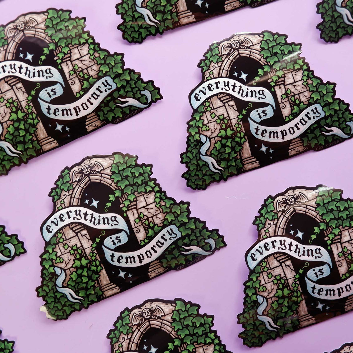 Stickers with 'Everything is temporary' design on a pink background