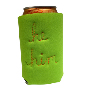 Light green neoprene drink holder with "he / him" embroidered on the back in cursive.