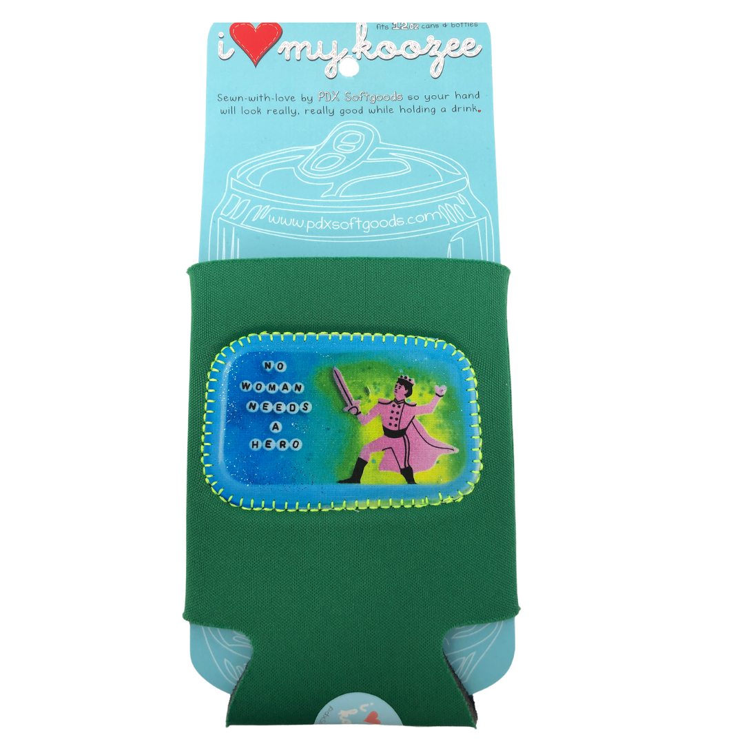 Green neoprene drink holder with patch on the front that says "No woman needs a hero." 
