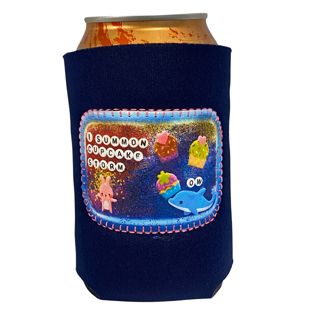 A purple neoprene drink holder that has "Cupcake Storm" on a patch on the front. 