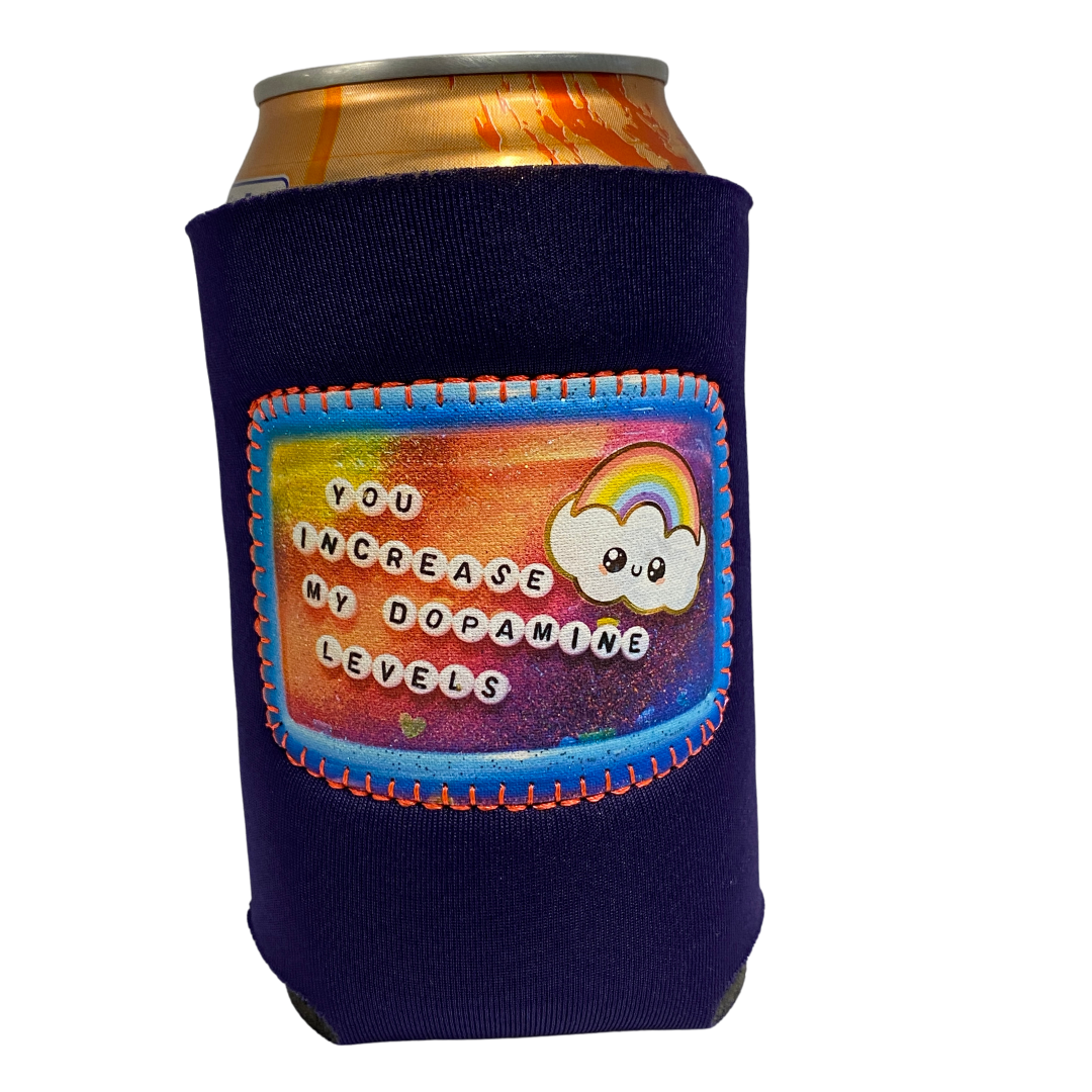Purple can cooler with a patch on the front that says "You increase my dopamine levels" 