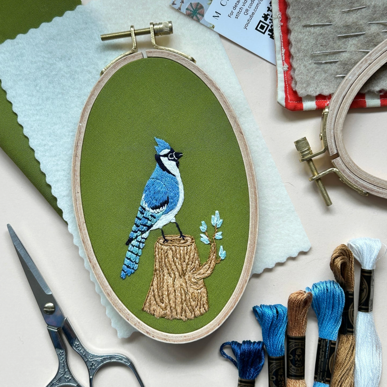 Completed sample Bluejay in the Woods embroidery kit by M Creative J. 
