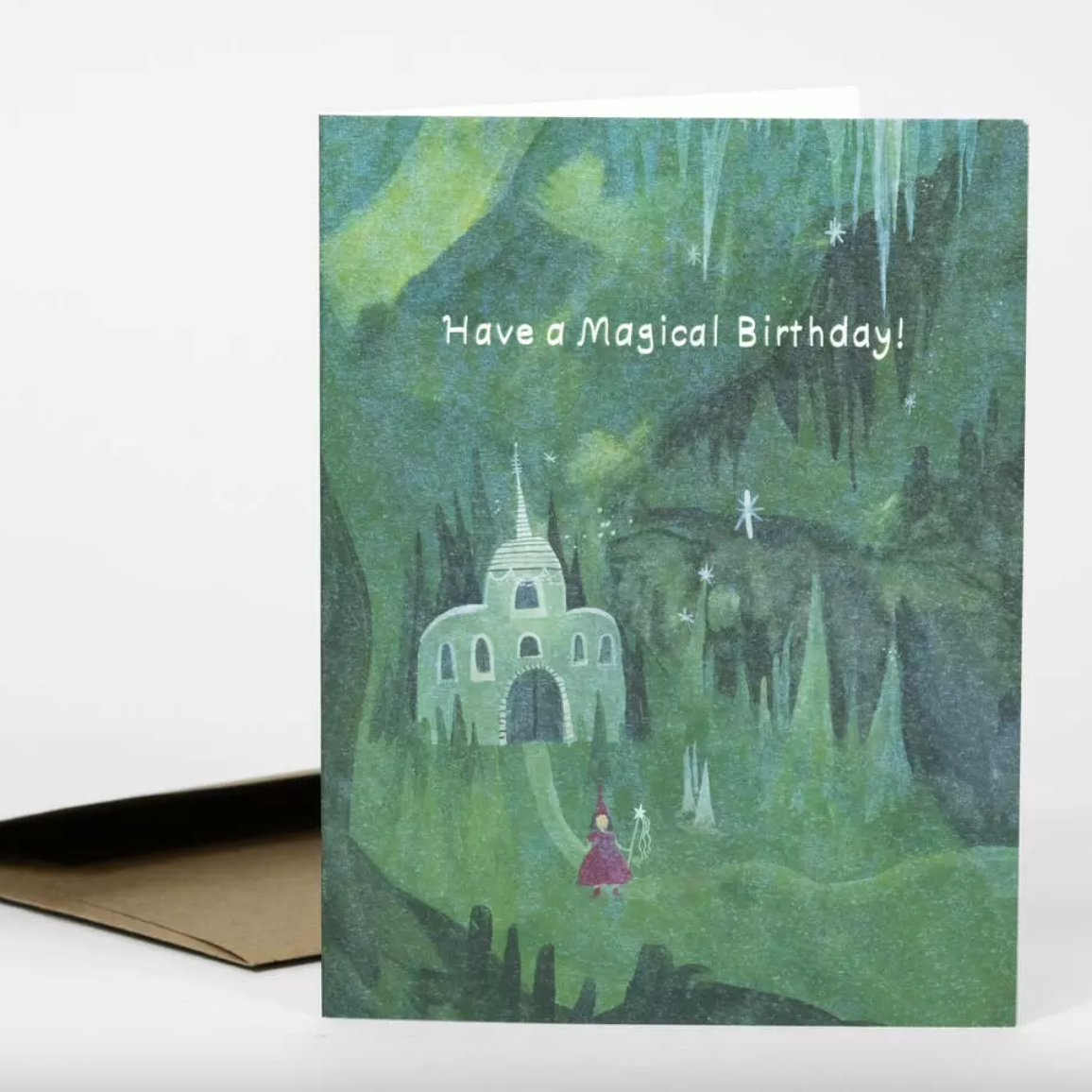 Greeting card with a fairy tale castle and text 'Have a Magical Birthday!' on a green forest background.