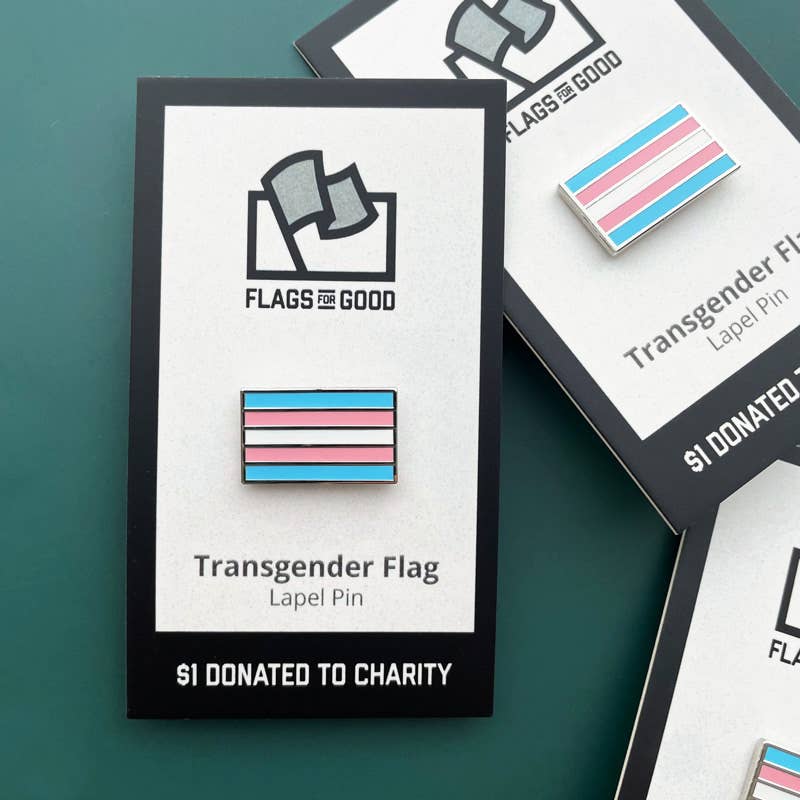 Transgender flag lapel pin with 'Flags for Good' branding on a green background