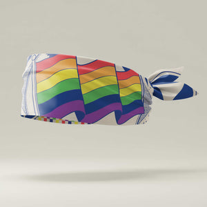 Colorful headband with rainbow pattern on a light gray background