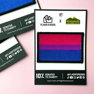 Bisexual flag patch with 'Flags for Good' branding on a pink background