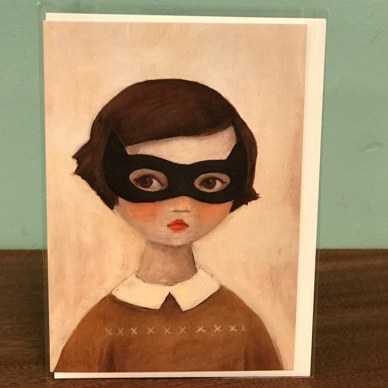 Illustration of a person wearing a black mask with a plain background