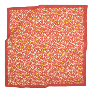 Red bandana with a small white and yellow floral pattern all over. 