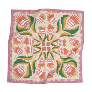 Floral patterned bandana in green, pink, and orange colors. 