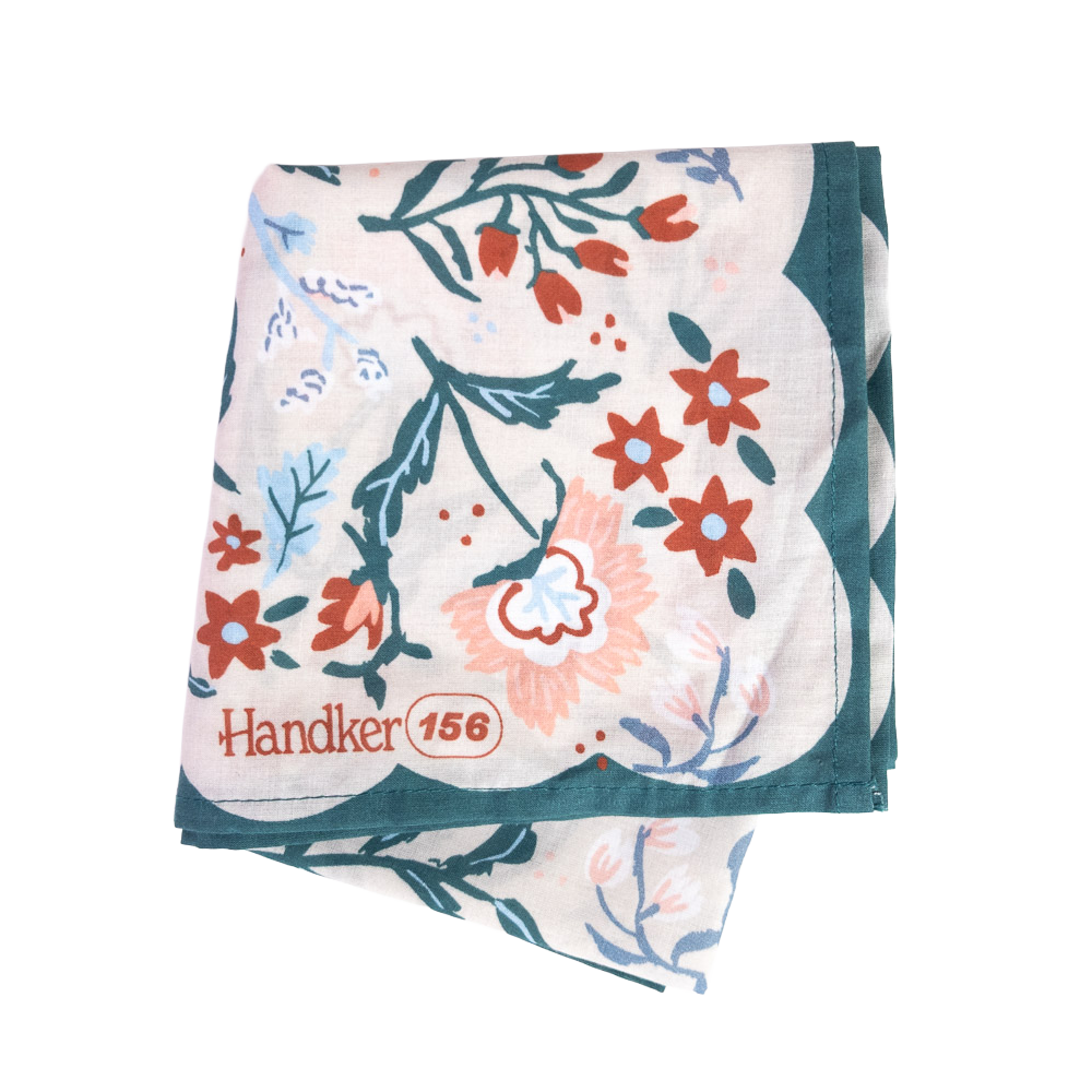 Floral patterned bandana folded into a square, showing just the corner of the design. 