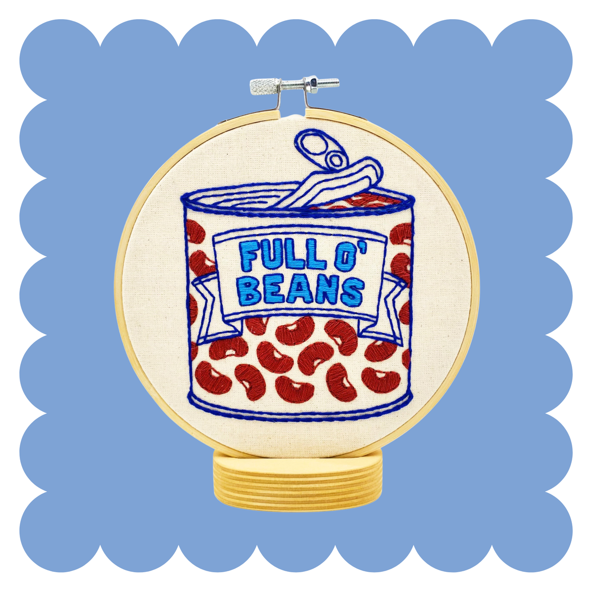 Decorative hoop with a can of beans embroidery illustration on a blue background