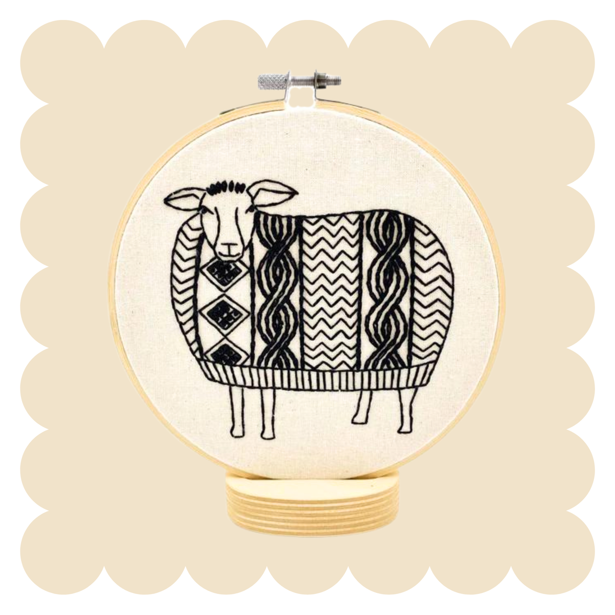 Sheep design in an embroidery hoop on a beige background