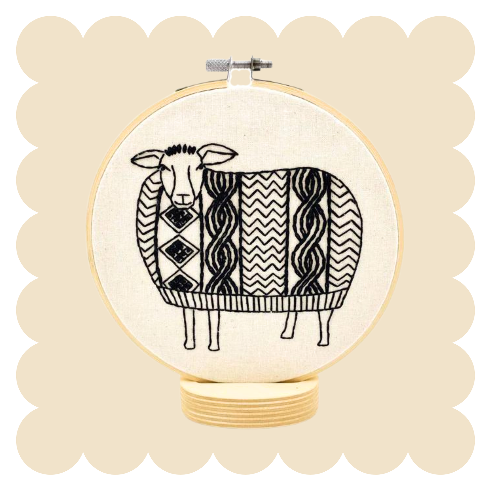 Sheep design in an embroidery hoop on a beige background