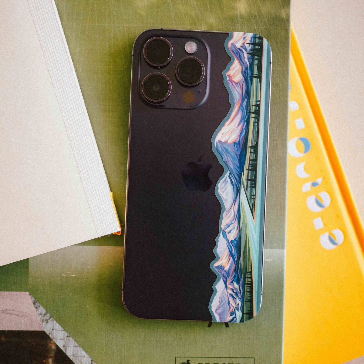 The cascade volcanoes miniscape sticker stuck onto the outside of an iphone