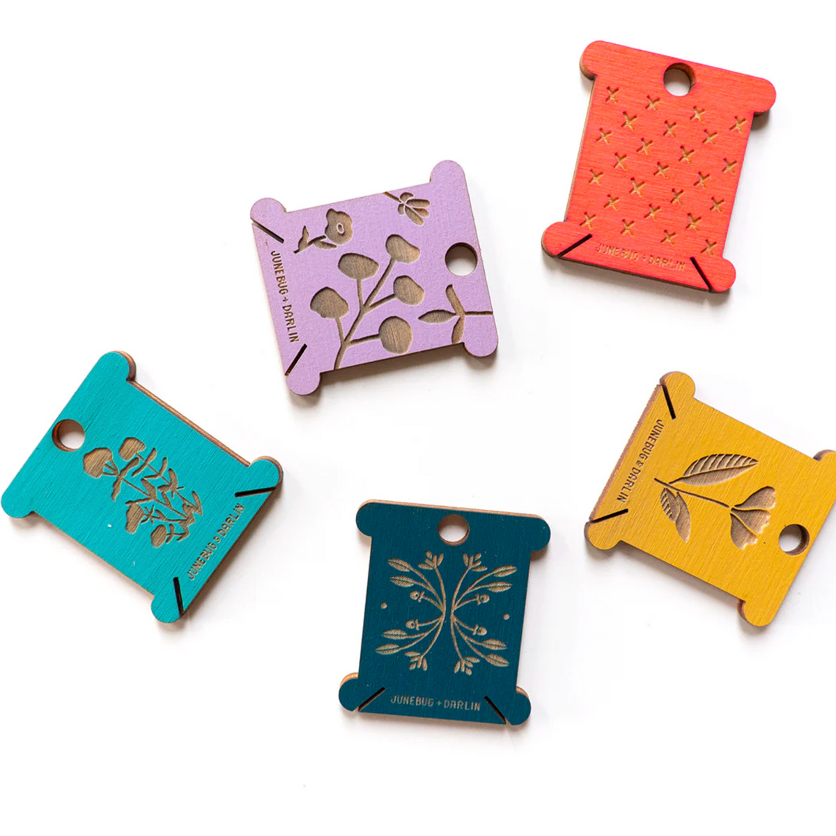 More examples of the designs and colors of floss bobbins you might receive in your random pack. 