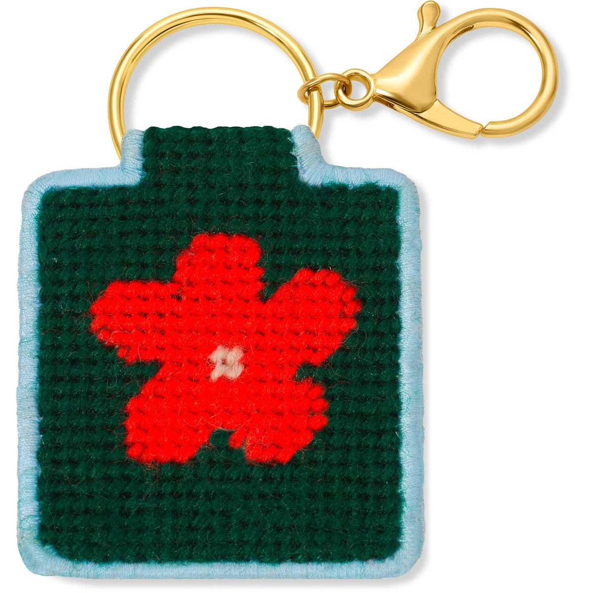 Needlepoint keychain featuring a design of a red flower on a dark green background with a blue background and gold hardware. 