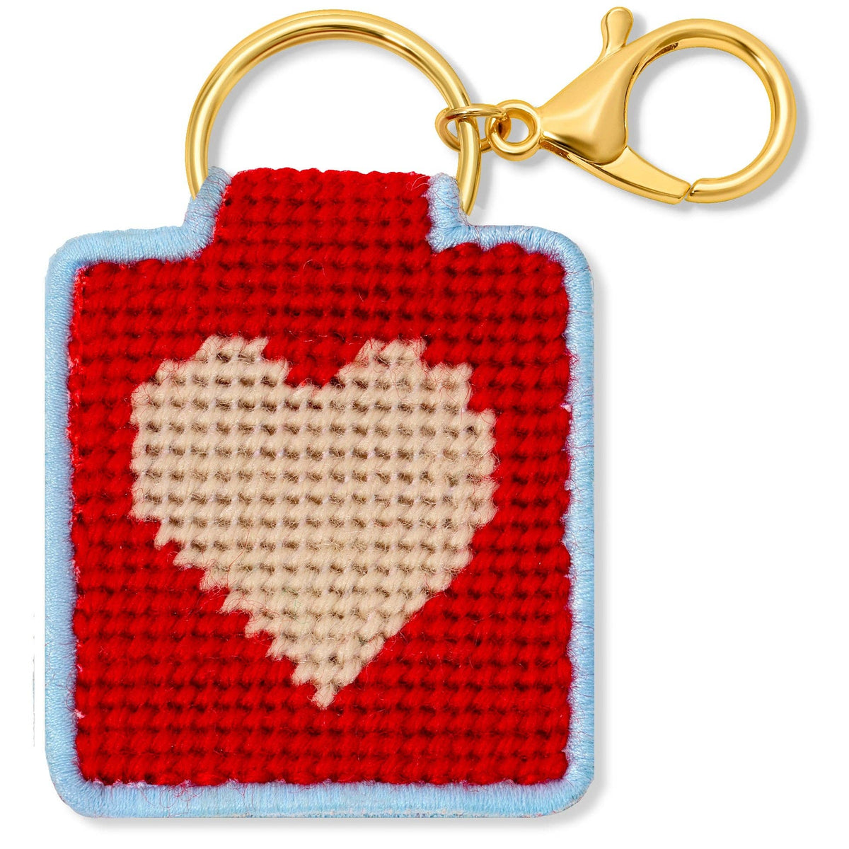 Needlepoint keychain featuring a pink heart on a red background with a blue border and gold hardware. 