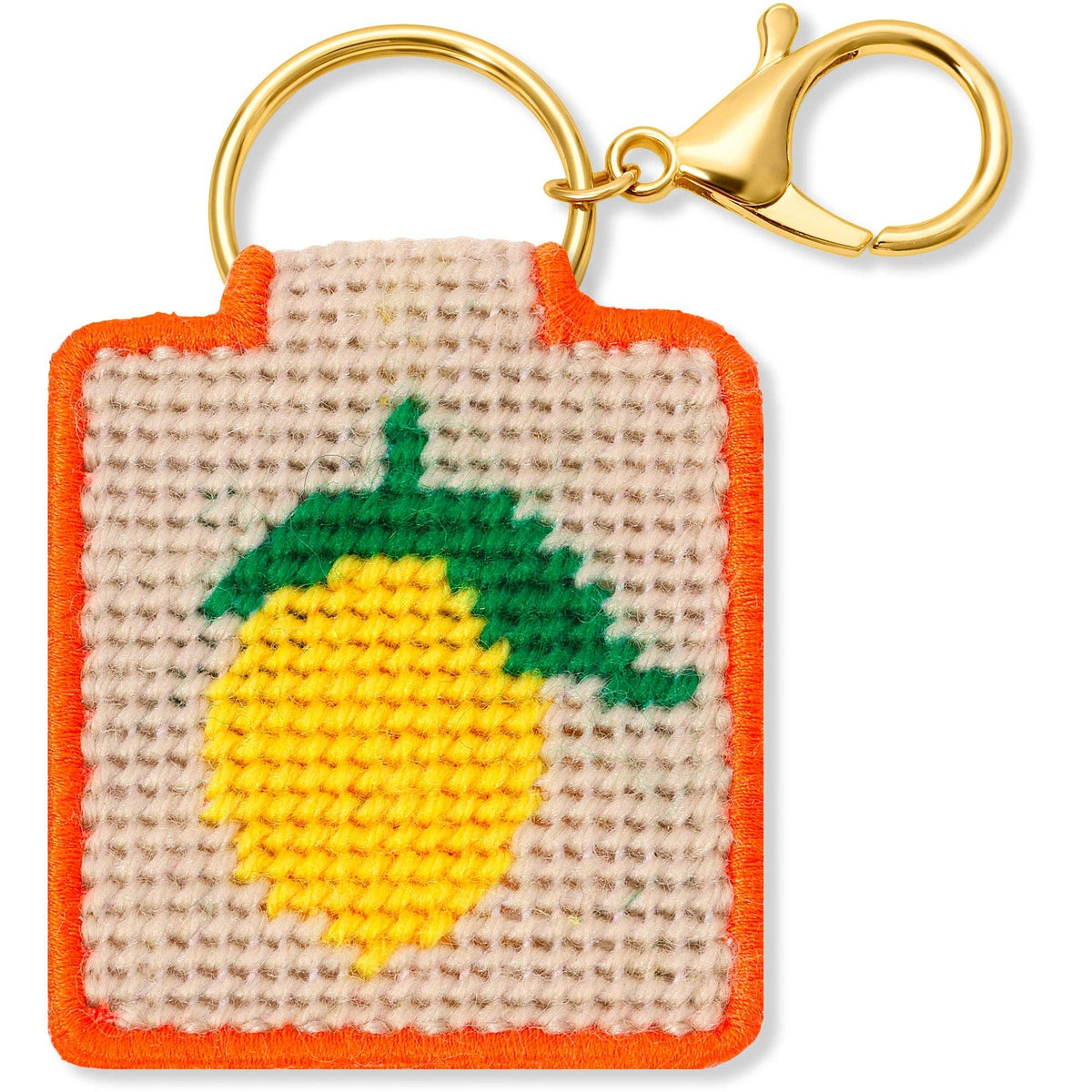 Needlepoint keychain with lemon design on a beige background