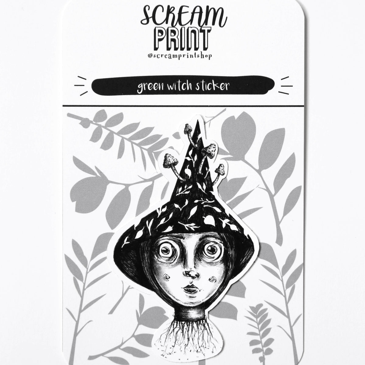 A rectangular printed card or packaging insert for a 'green witch sticker' by Scream Print, featuring a black and white illustration of a witch's head with a pointed hat and leafy botanical details on a white background.