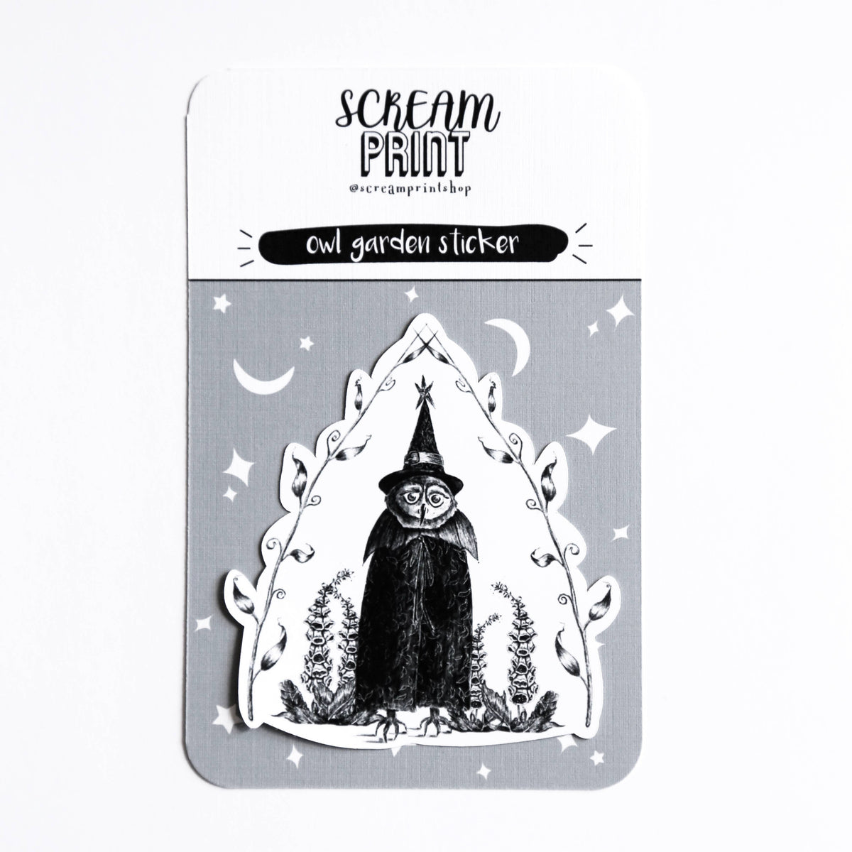 A die-cut sticker featuring a black and white illustration of an owl in a pointed hat, displayed on its gray backing card with the brand name 'Scream Print' visible at the top.