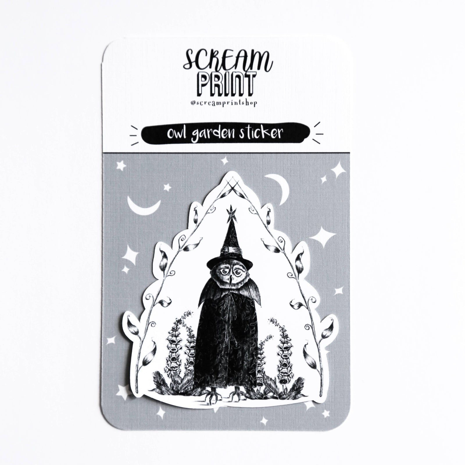 A die-cut sticker featuring a black and white illustration of an owl in a pointed hat, displayed on its gray backing card with the brand name 'Scream Print' visible at the top.