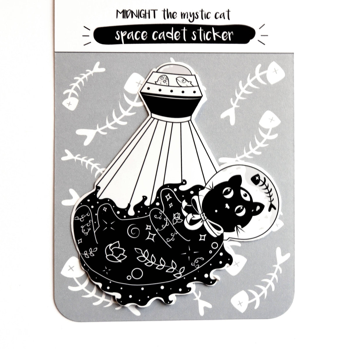A product card for a 'Scream Print' sticker titled 'Midnight the Mystic Cat space cadet sticker'. The card features a black and white illustration of a cat beneath a UFO, surrounded by fish bones on a light gray background.