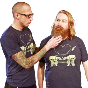 Two men wearing t-shirts with a graphic design of a heart and two AT-AT.