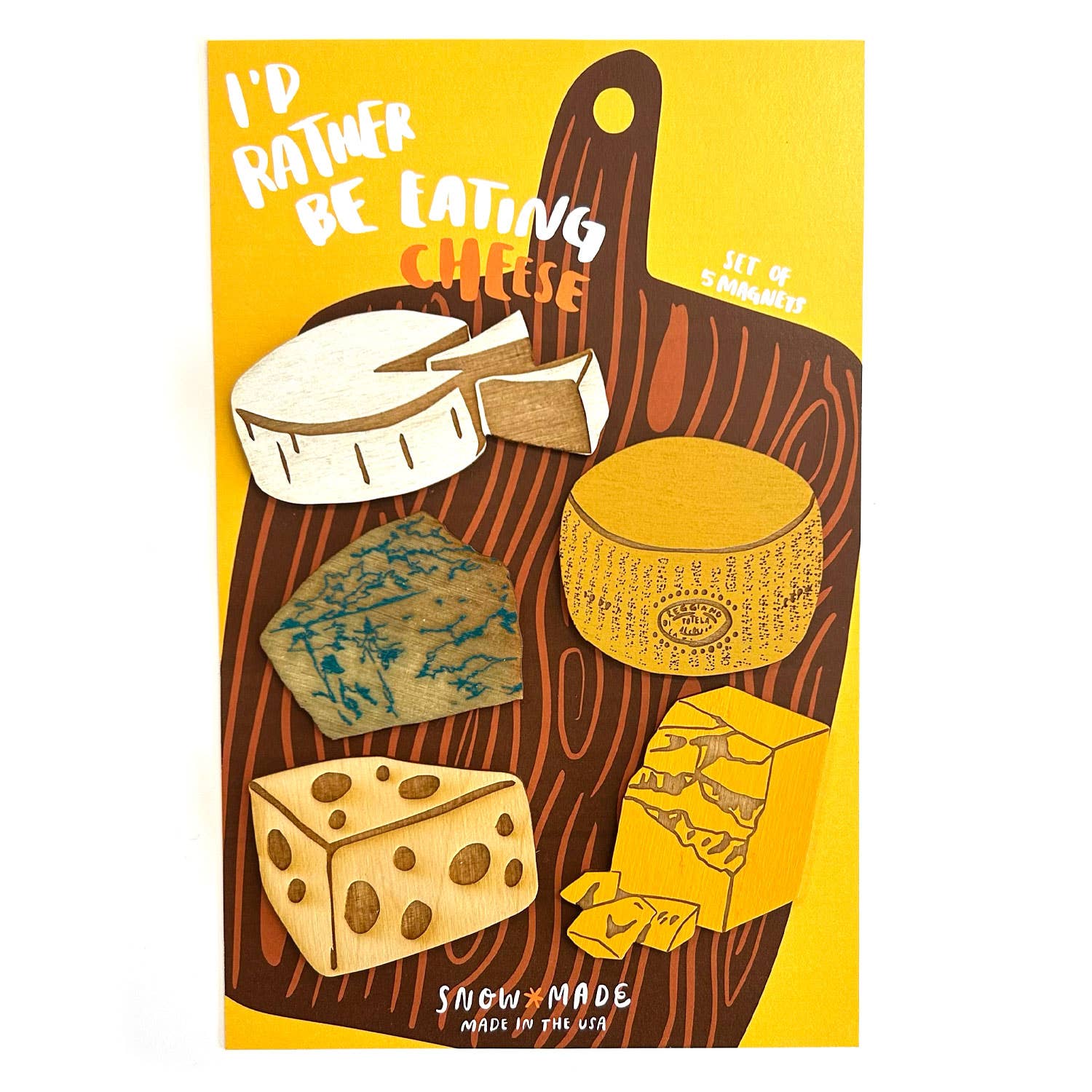 Set of five wooden magnets of different kinds of cheese on a background of a wooden cheese board and text that says "I'd rather be eating cheese"