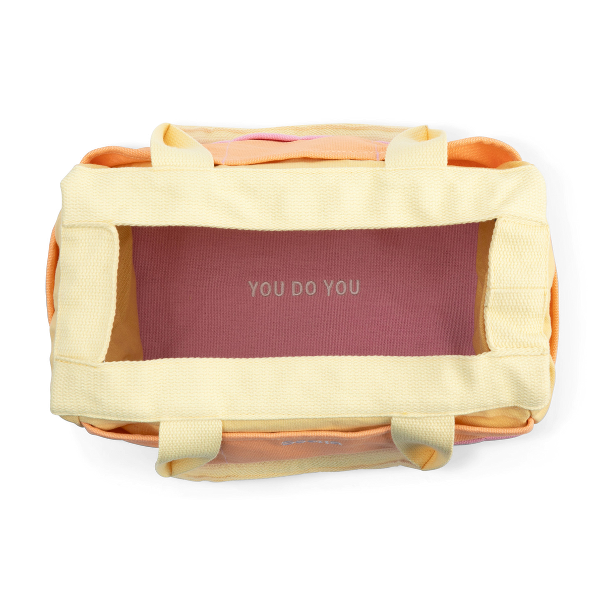 Yellow tote bag with 'YOU DO YOU' branding on a white background