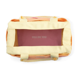 Yellow tote bag with 'YOU DO YOU' branding on a white background