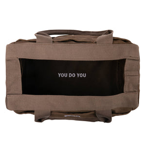 Brown bag with 'YOU DO YOU' branding on a white background