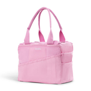 Pink tote bag with handles on a white background