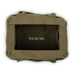 Green bag with 'YOU DO YOU' text on a white background