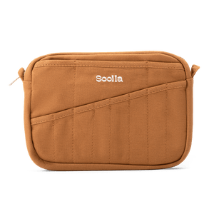 A brown canvas pouch with a diagonal front pocket and the brand name 'Soolla' embroidered in white on the front, shown against a plain white background.