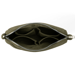 Green pouch with a zipper on a black background