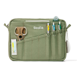 Green pouch with various items including a pair of scissors and markers, branded 'Soolla'.