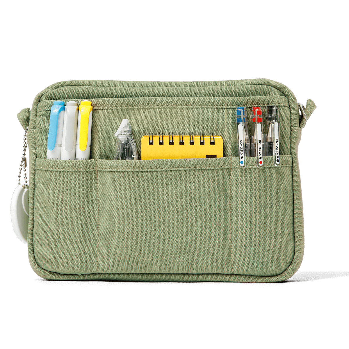 Green pouch with compartments holding stationery items on a white background