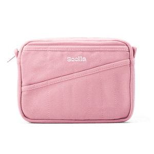 A pink canvas pouch with a diagonal pocket detail and the brand name 'Soolla' printed in white on the front, set against a plain white background.