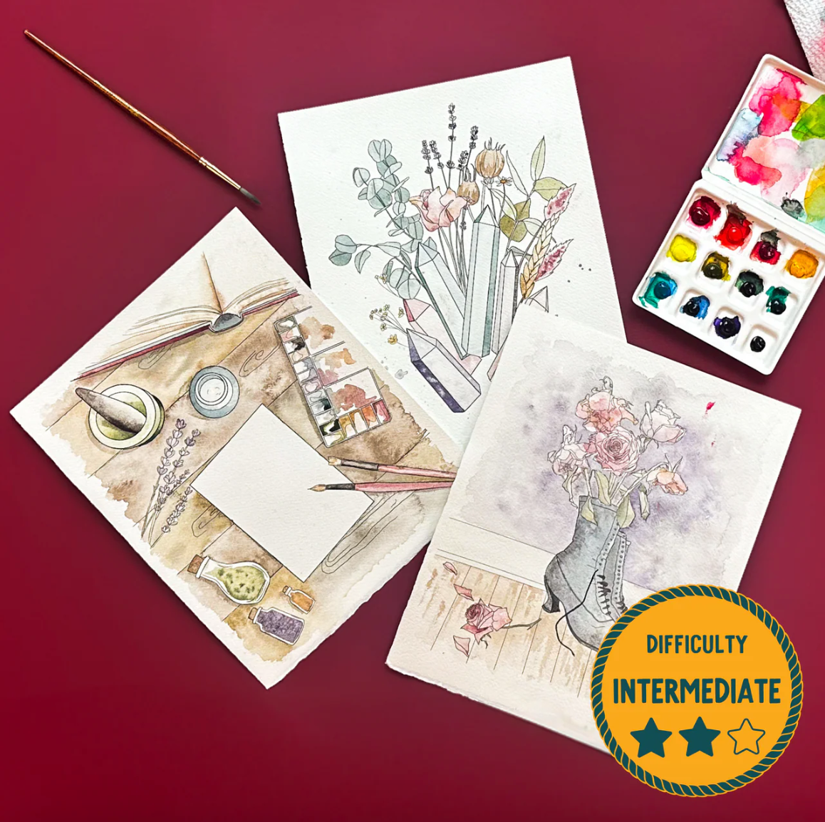 Artistic illustrations on paper with watercolor set and paintbrush on a red background, difficulty indicator shown.