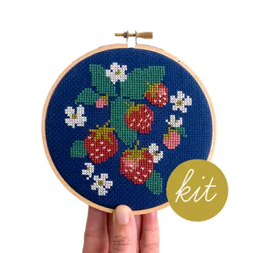 A finished, stitched up example of the Spread Like Strawberries cross stitch kit by Junebug & Darlin'. 