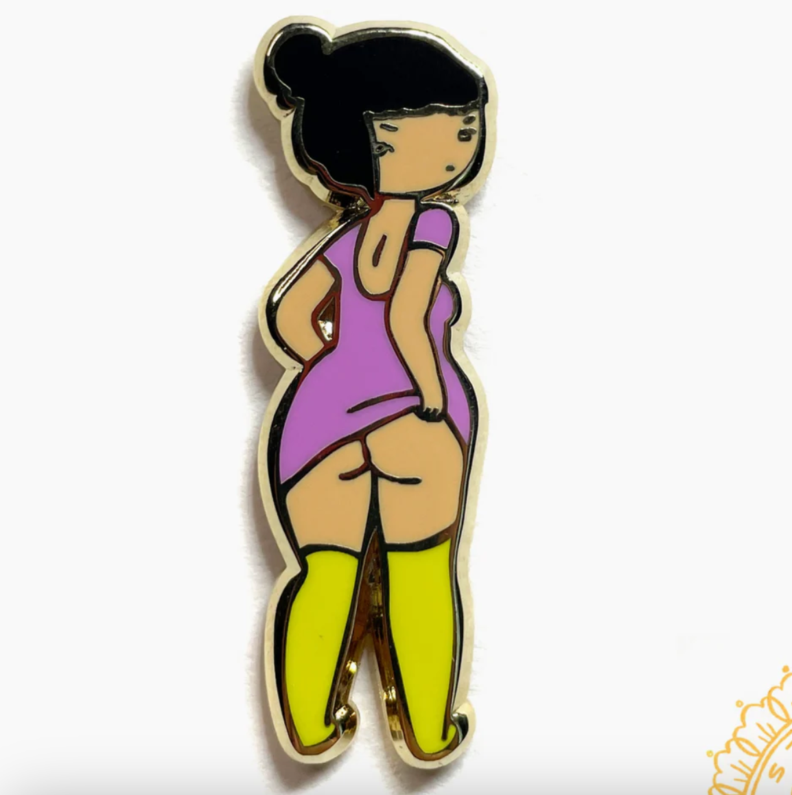 Enamel pin of a girl wearing a pink dress and yellow stockings lifting up her top to show her butt.