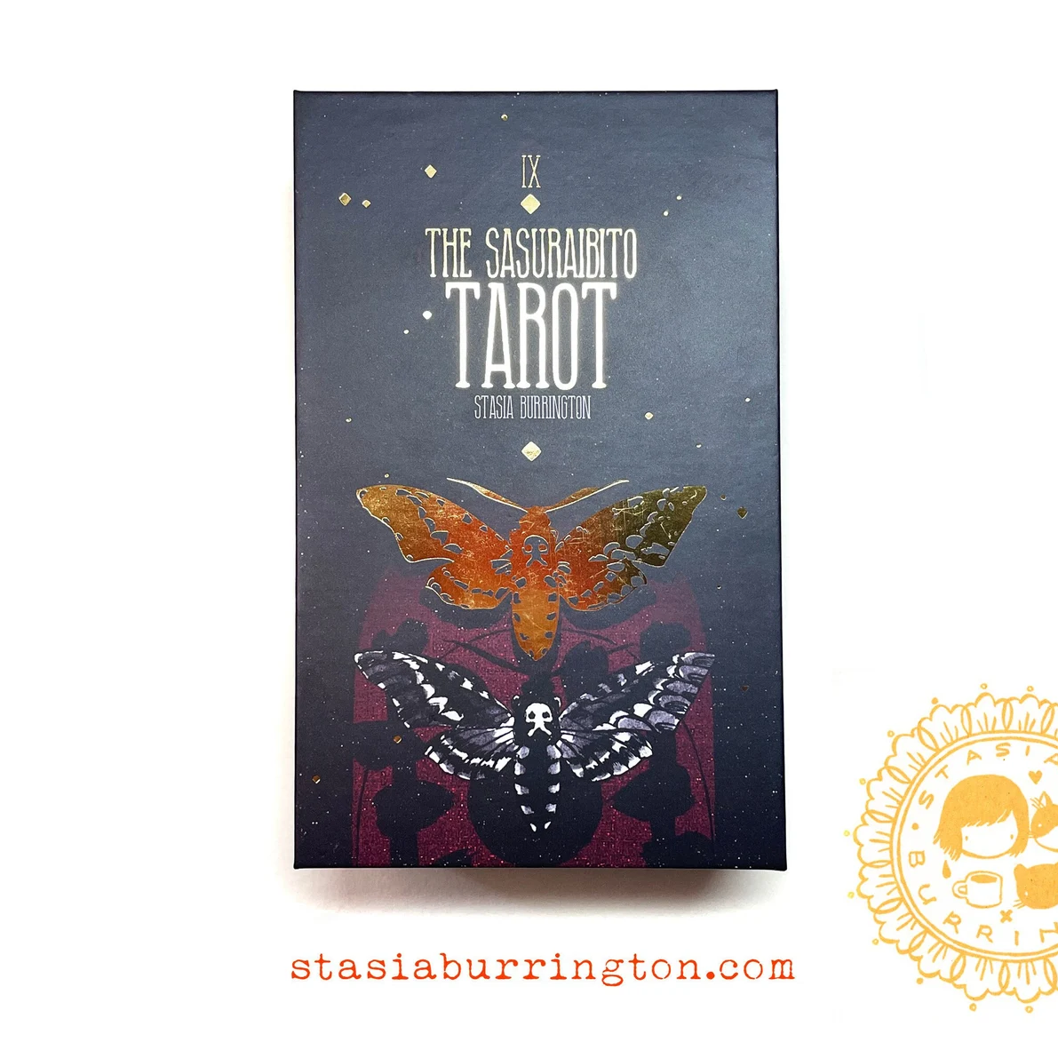 The image shows a closed box of the Sasurabito Tarot Deck with a butterfly graphic 