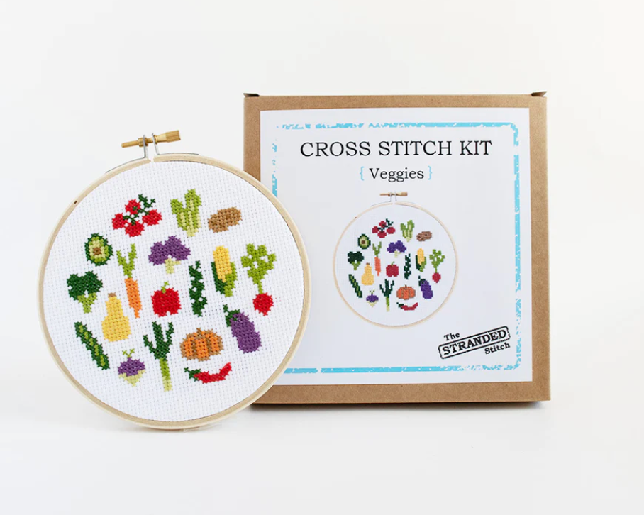 Veggies Cross Stitch Kit packaging and finished cross stitch against a white background. 