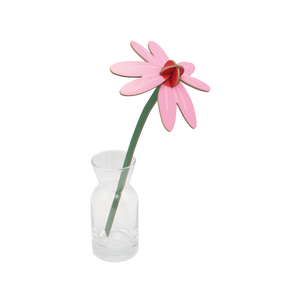 Pink and red cardboard flower in a small glass vase. 