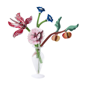 Vase full of paper flowers and a branch with peaches on it. 