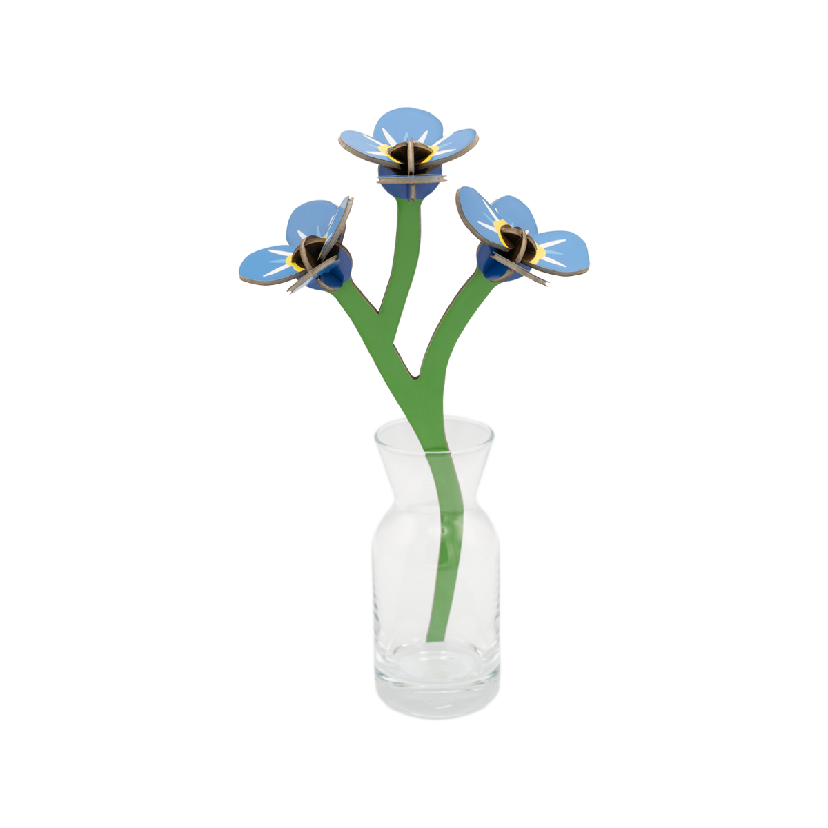 Stem of forget-me-nots made out of cardboard in a small glass vase. 