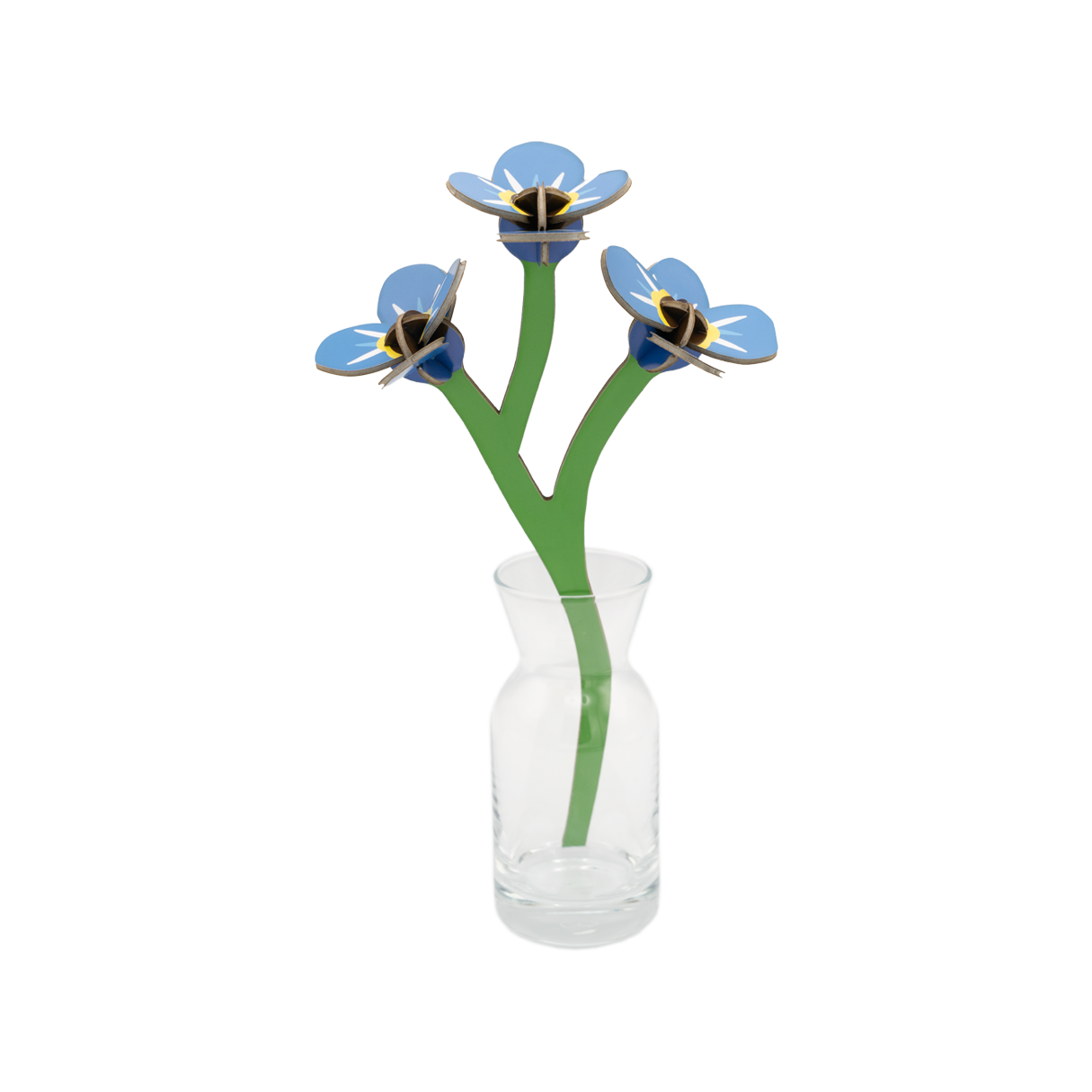 Stem of forget-me-nots made out of cardboard in a small glass vase. 