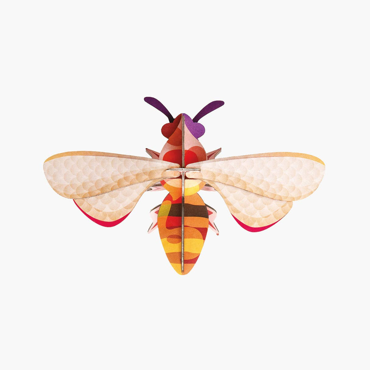 Cardboard sculpture of a honey bee against a white background. 