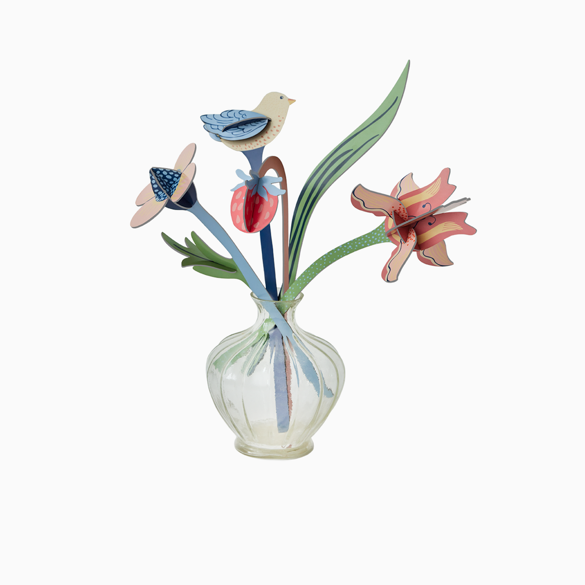 Bouquet of paper flowers in a small glass vase against a white background. 