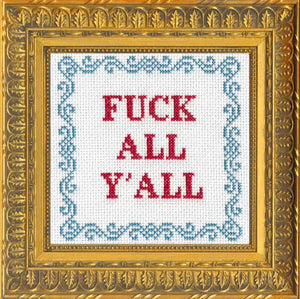 Cross-stitched phrase 'FUCK ALL Y'ALL' in a decorative gold frame.